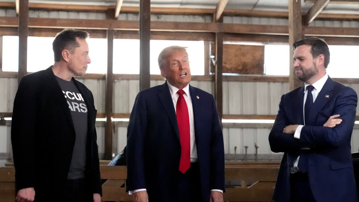 Trump Says Elon Musk Could Face 'Serious Consequences' If He Backs Democratic Candidates FILE - Tesla and SpaceX CEO Elon Musk, from left, Republican presidential nominee former President Donald Trump and Republican vice presidential nominee Sen. JD Vance, R-Ohio, attend a campaign event, Oct. 5, 2024, in Butler, Pa.