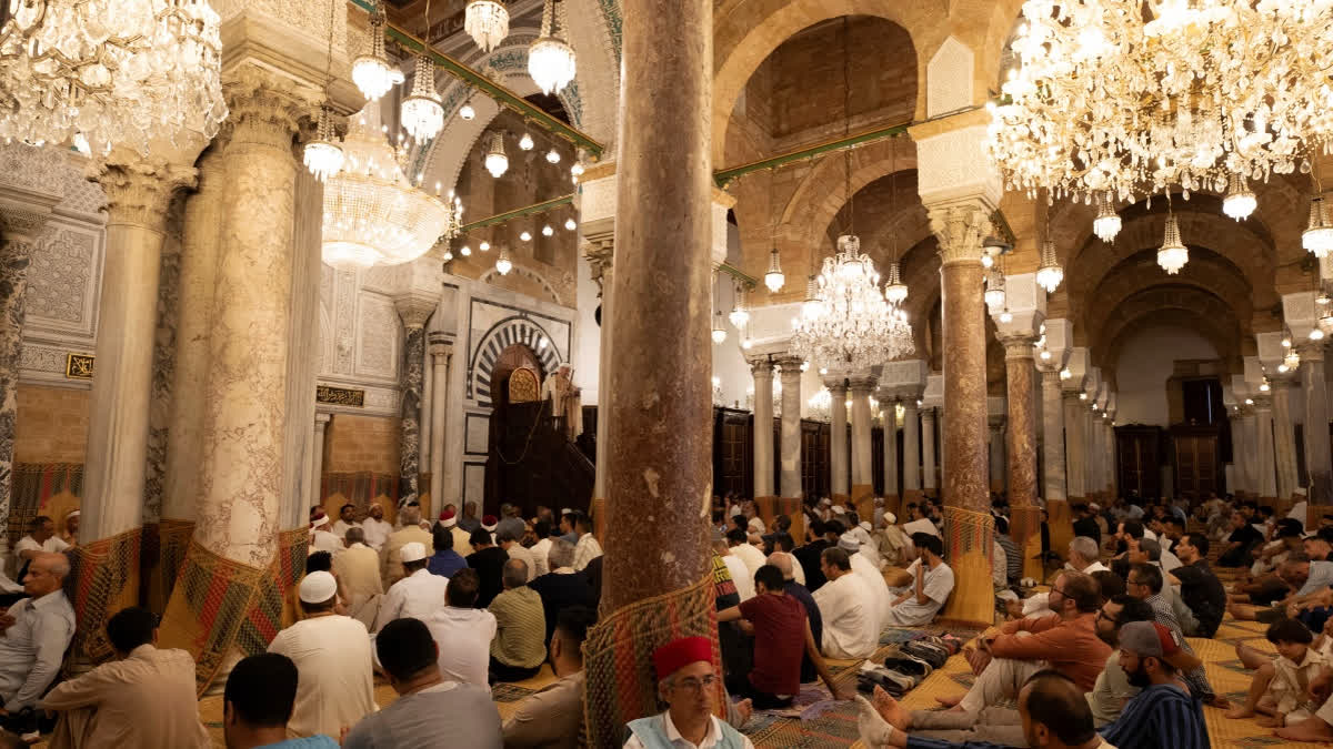 Muslims gather to perform Eid al-Adha prayers at Zaytuna Mosque in Tunis, Tunisia, Friday