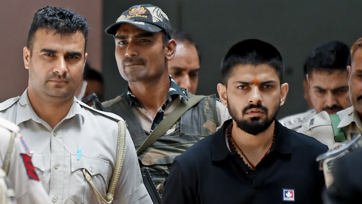 Gangster Lawrence Bishnoi leaves after appearing before the Patiala House Court, in New Delhi on Apr 18, 2023.