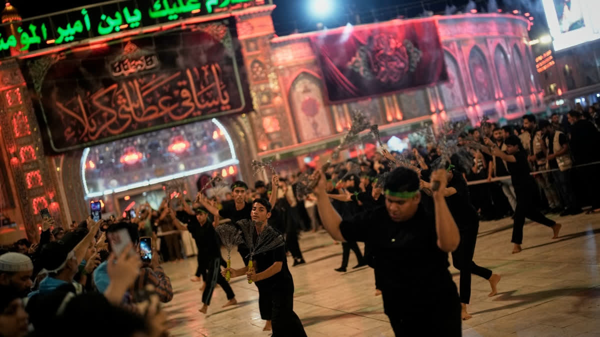 Shiite mourners perform ritual self-flagellation with chains outside the Imam Hussein Shrine on the eve of funeral ceremonies for the late Iranian Supreme Leader Ayatollah Ali Khamenei in Karbala, Iraq, Tuesday, July 7, 2026.