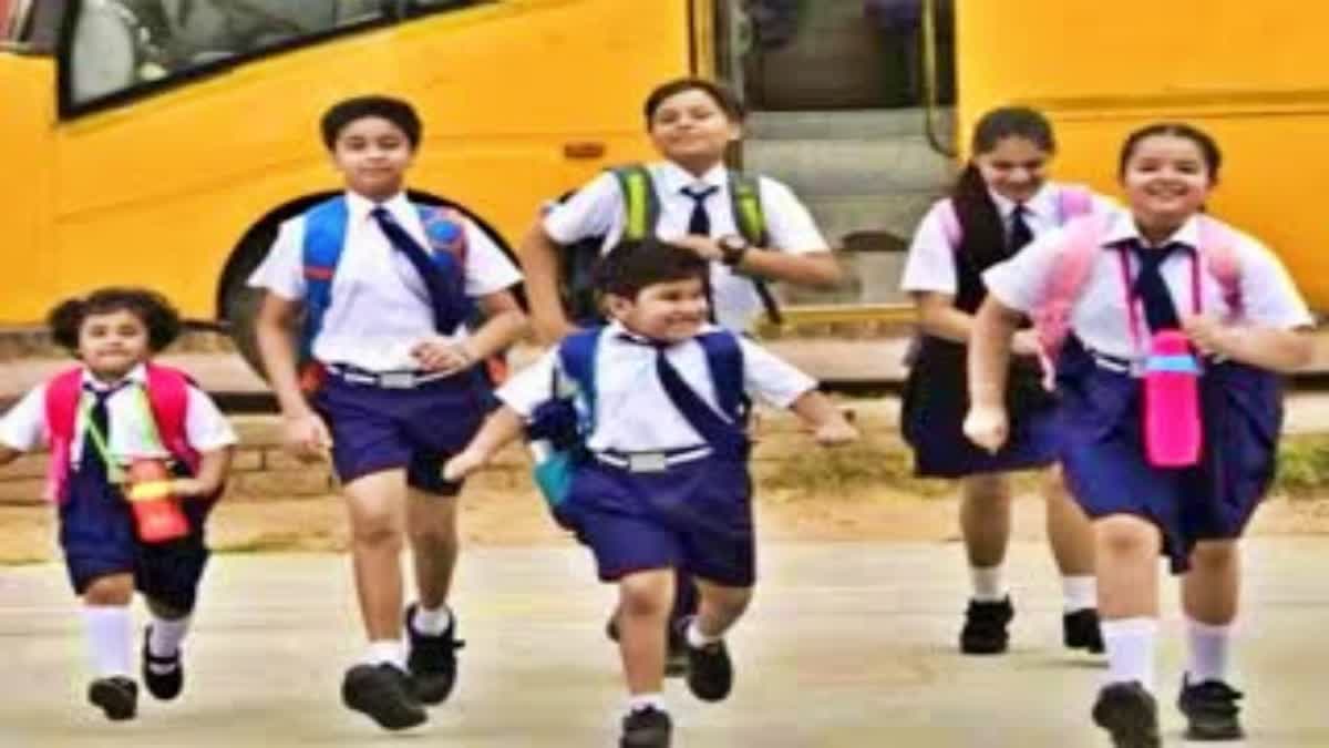 Young Children Carrying Weight Of Books