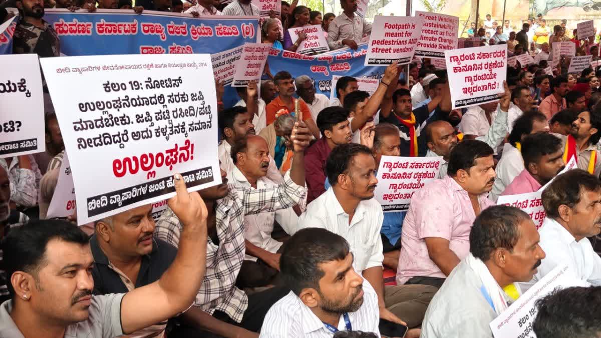 Thousands of street vendors protest in Bengaluru on Tuesday against the ongoing footpath clearance drive.