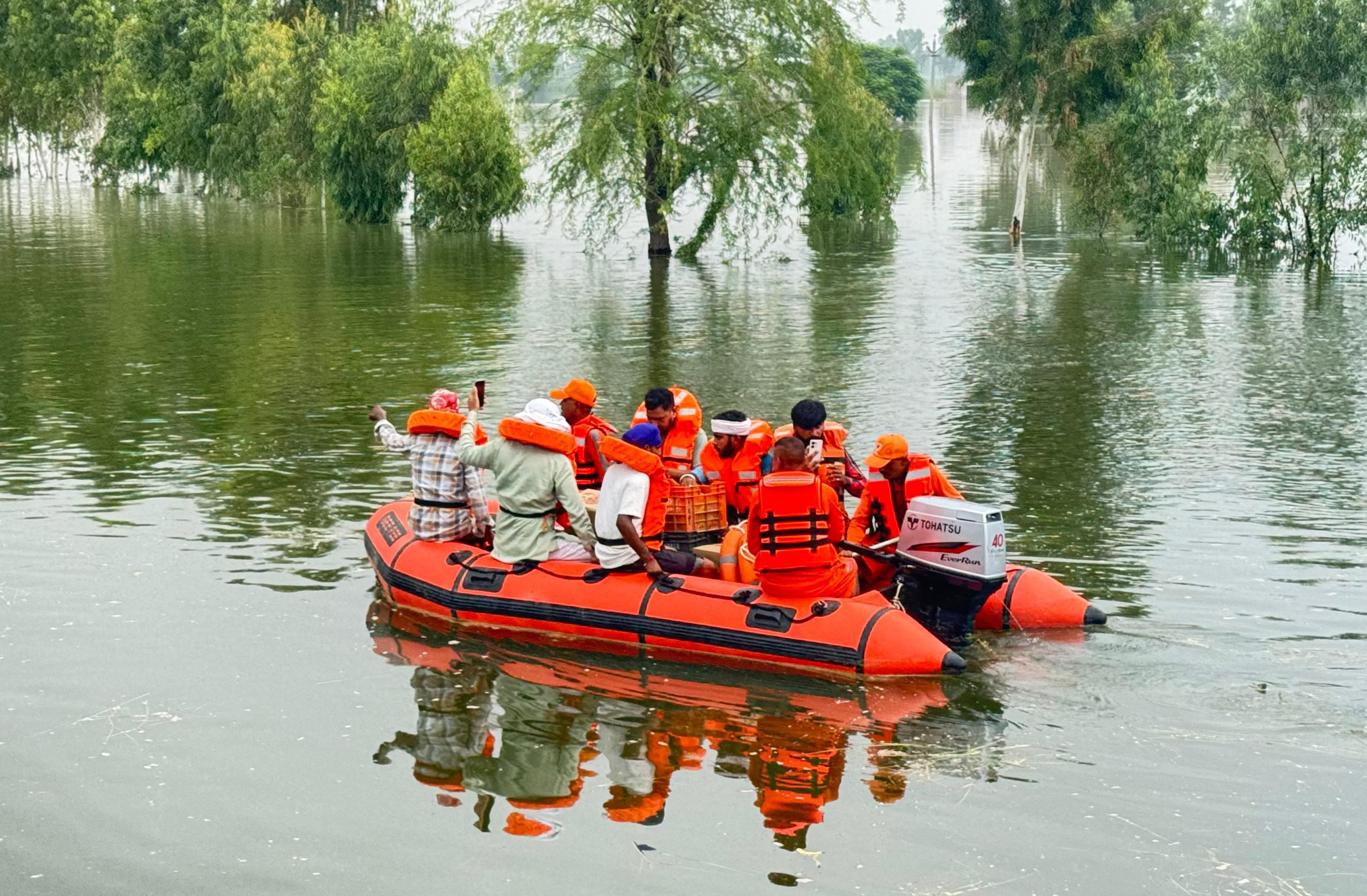 NDRF personnel conduct floodwater rescue operations in flood-affected areas, assisting the civil administration in relief distribution and providing medical aid, in Punjab.