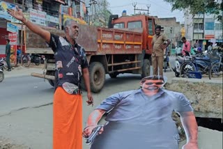 அகற்றப்பட்ட  கட்அவுட் மற்றும் தவெக தொண்டர்