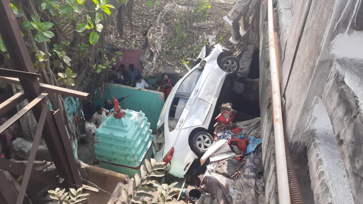 car fell down from overbridge and hit the house at bbsr