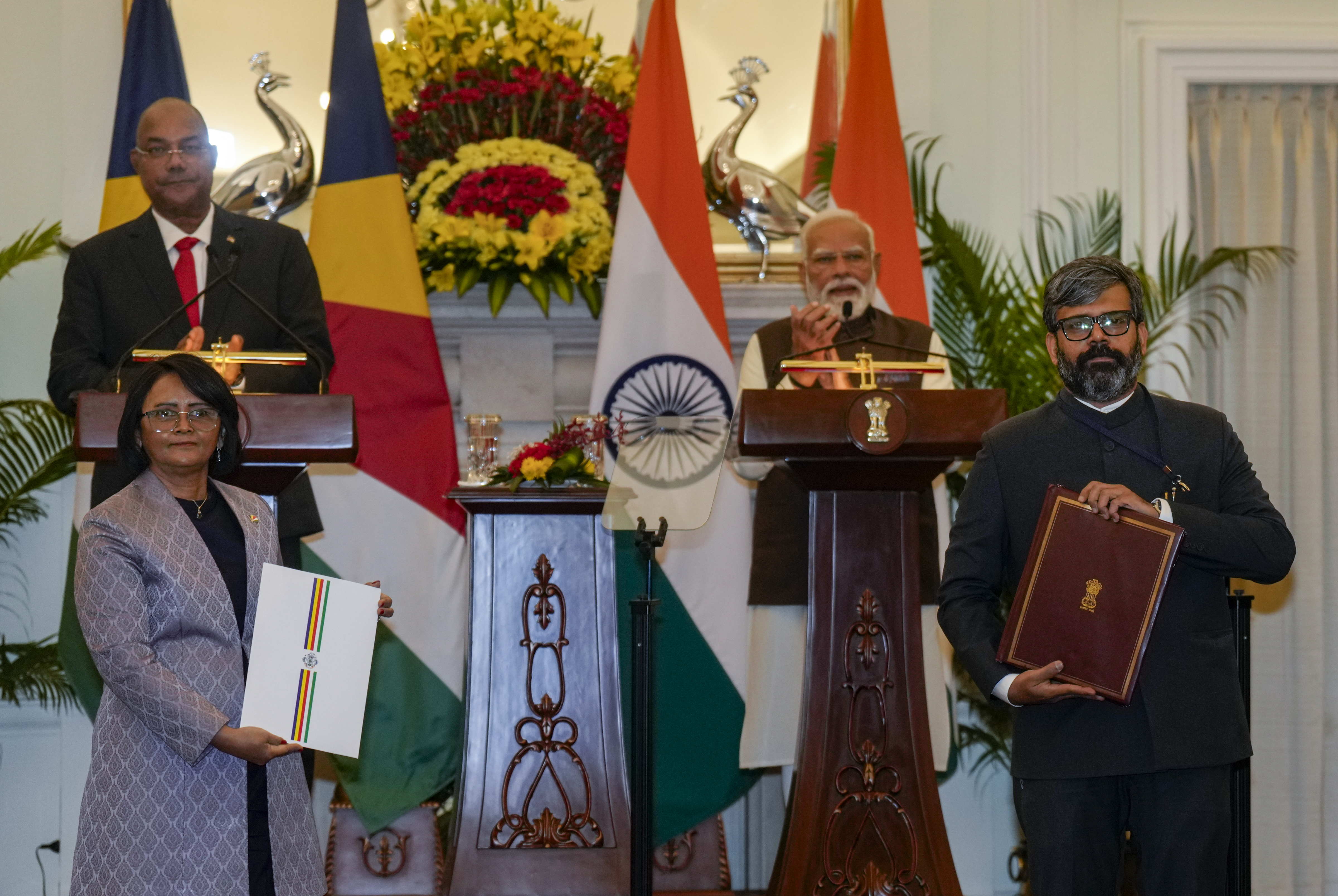 High Commissioner of India to Seychelles Rohit Rathish, right, and High Commissioner of Seychelles to India Lalatiana Accouche exchange documents during a joint press statement after a meeting between Prime Minister Narendra Modi and President of Seychelles Patrick Herminie, at the Hyderabad House, in New Delhi, Monday, Feb. 9, 2026.