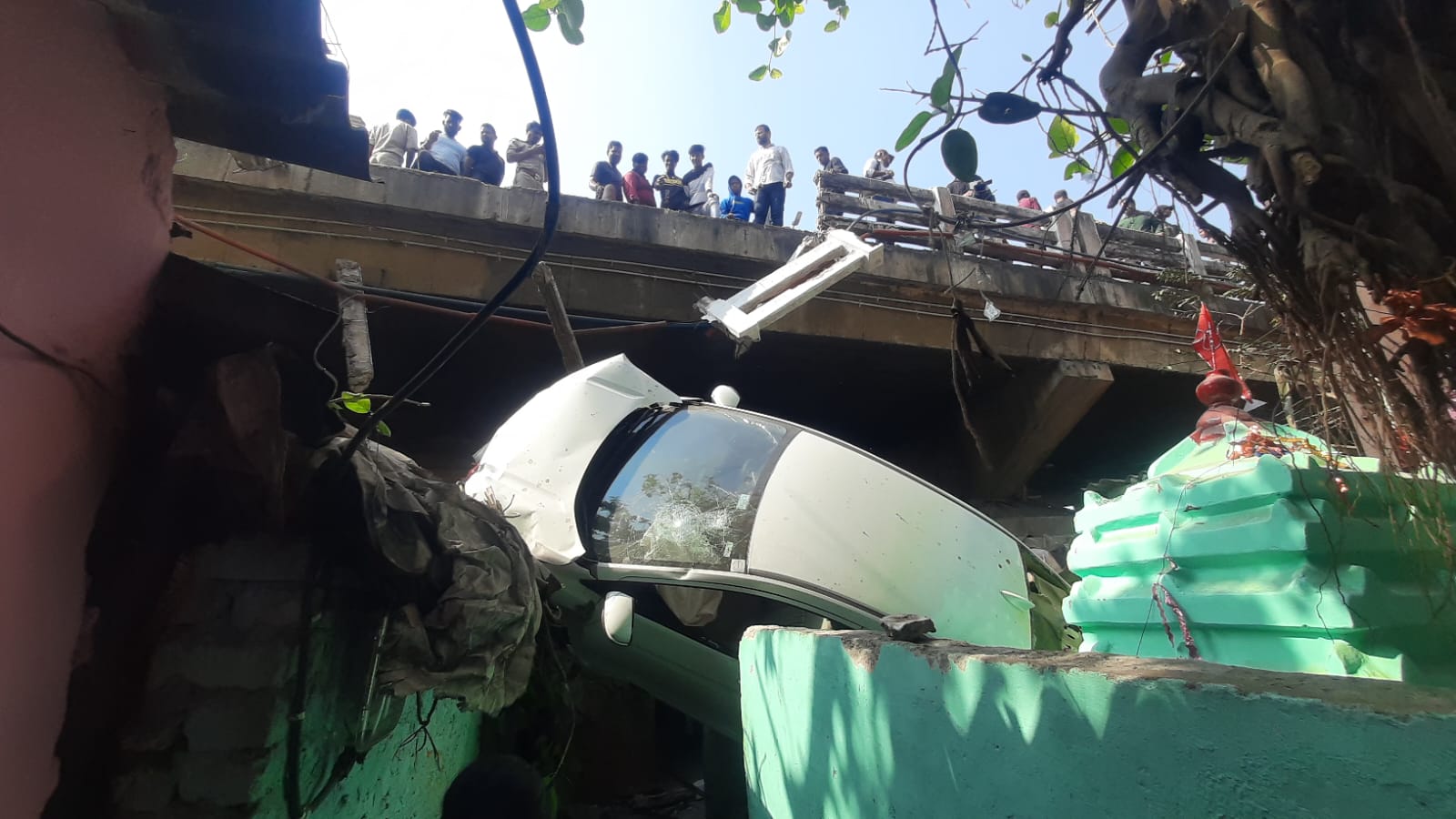 car fell down from overbridge and hit the house at bbsr