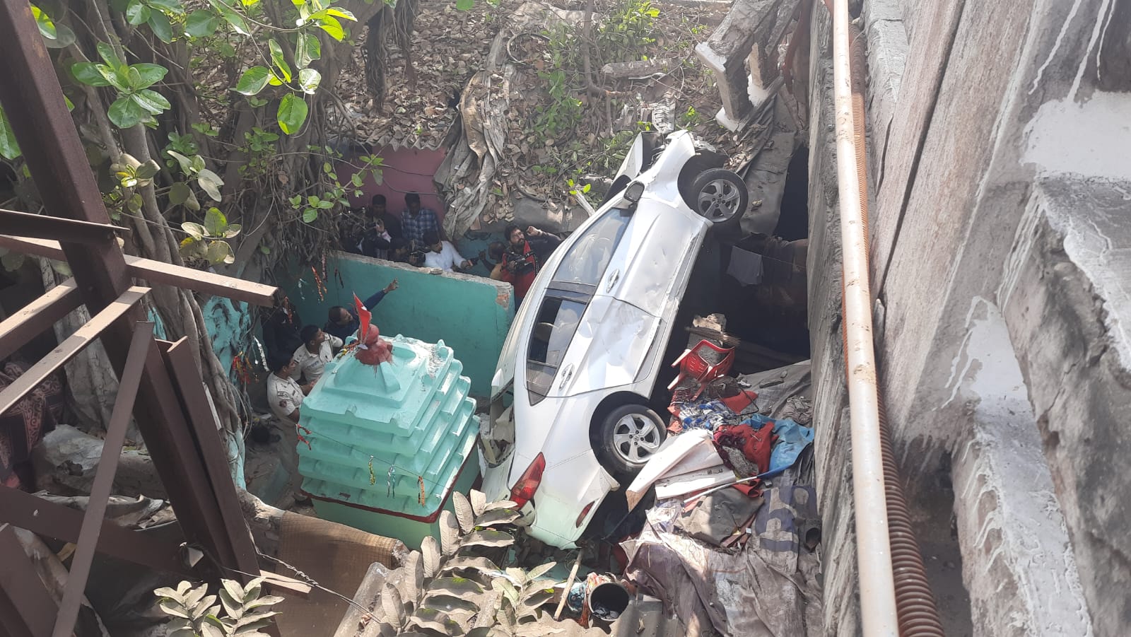 car fell down from overbridge and hit the house at bbsr