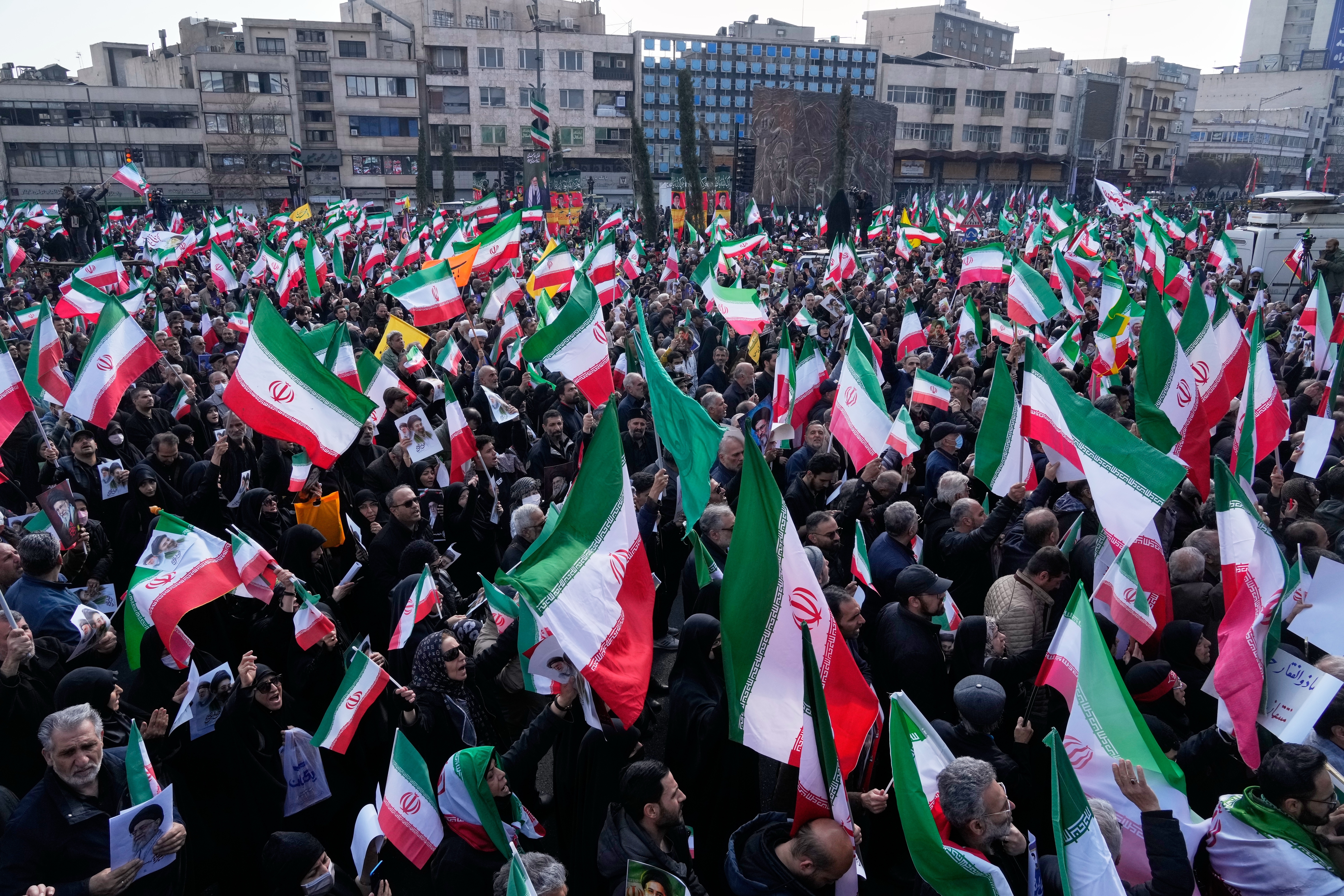 A crowd holding Iranian flags gathers during a demonstration in support of the nomination of Ayatollah Mojtaba Khamenei as successor to his late father, Ayatollah Ali Khamenei, as supreme leader, in Tehran, Iran, Monday, March 9, 2026.