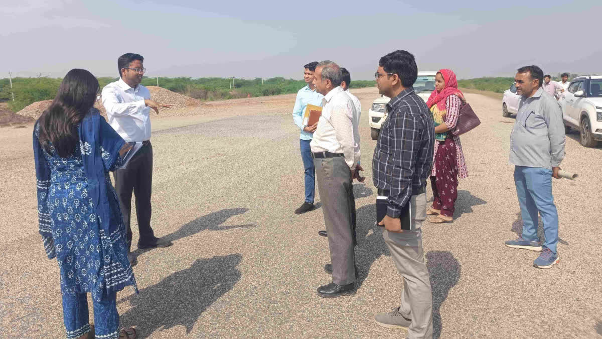Collector and others inspecting the airstrip