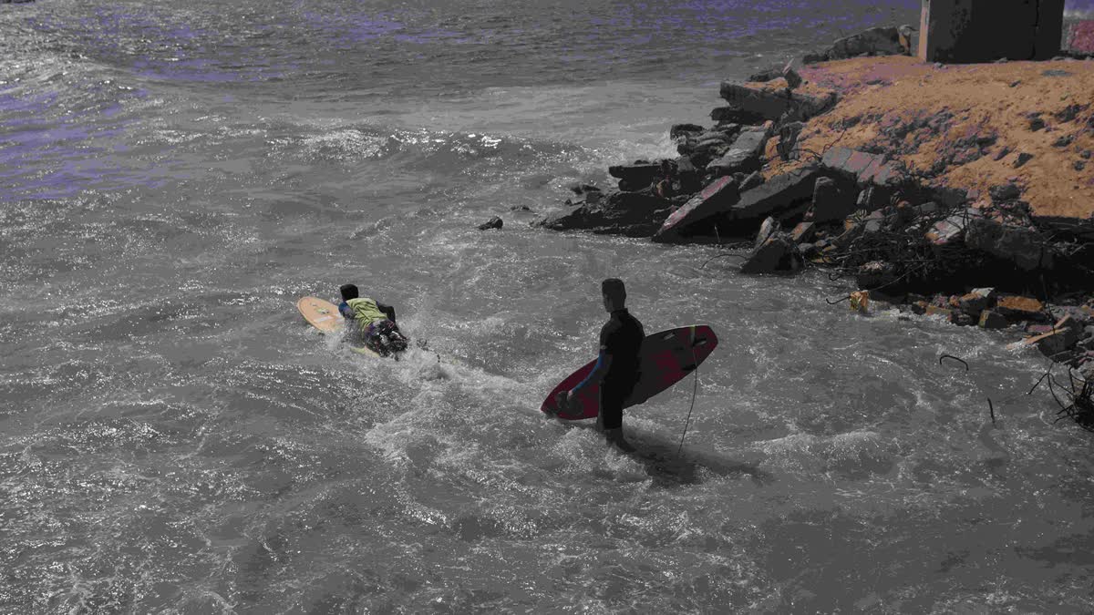 Surfers in Mediterranean coastal waters