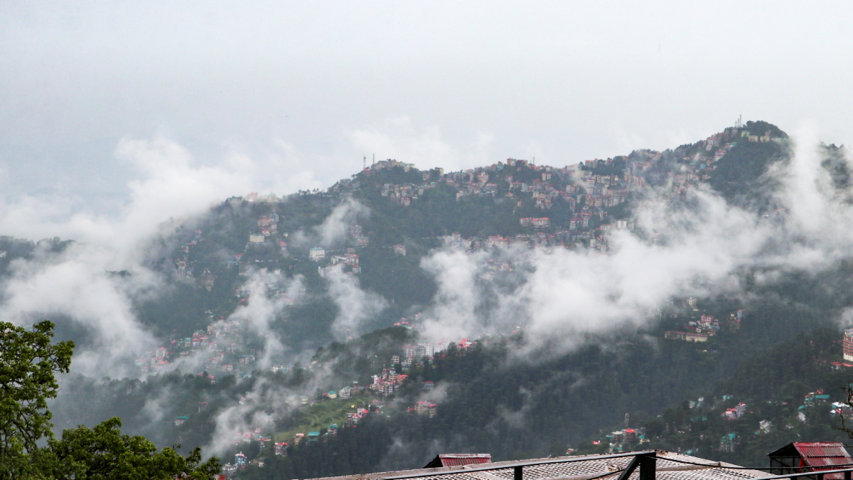 Low clouds descend over the hills surrounding Shimla following heavy rainfall on Thursday.