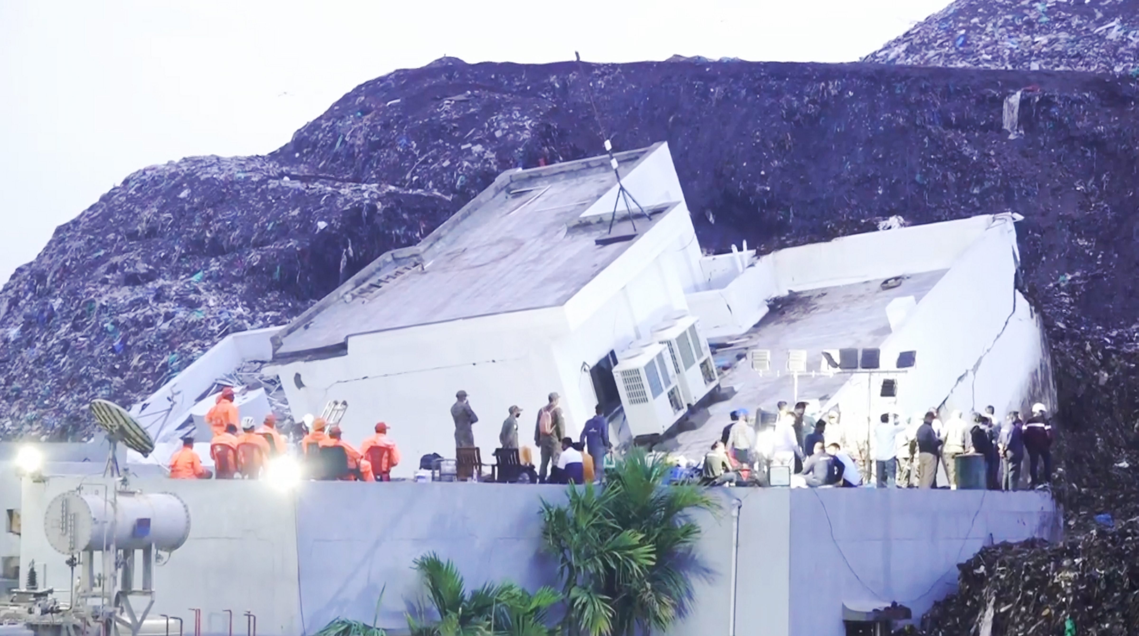 Rescue personnel carry out operations at the site where a three-storey administrative building collapsed at the Pimpri Chinchwad Municipal Corporation's waste-to-energy plant in Moshi following heavy rainfall, in Pune, on Thursday.