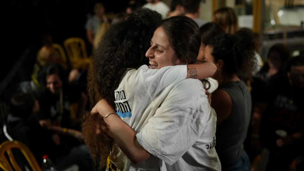 Relatives and supporters of Israeli hostages held by Hamas celebrate after announcement that Israel and Hamas have agreed to the first phase of a peace plan, as they gather at a plaza known as the hostages square in Tel Aviv, Israel, Thursday, Oct. 9, 2025