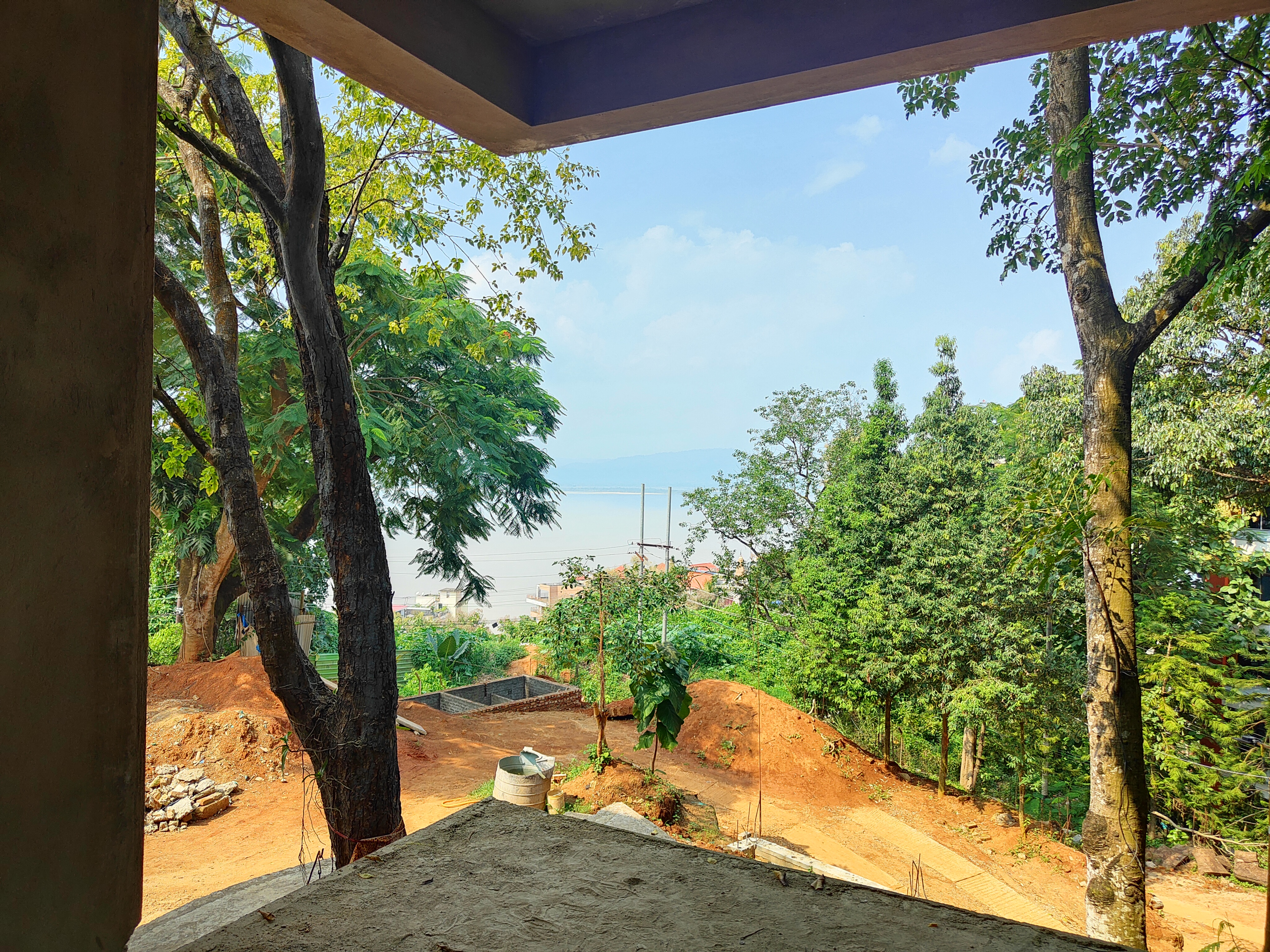 What is the condition of the house under construction in Kharguli belonging to Zubeen Garg