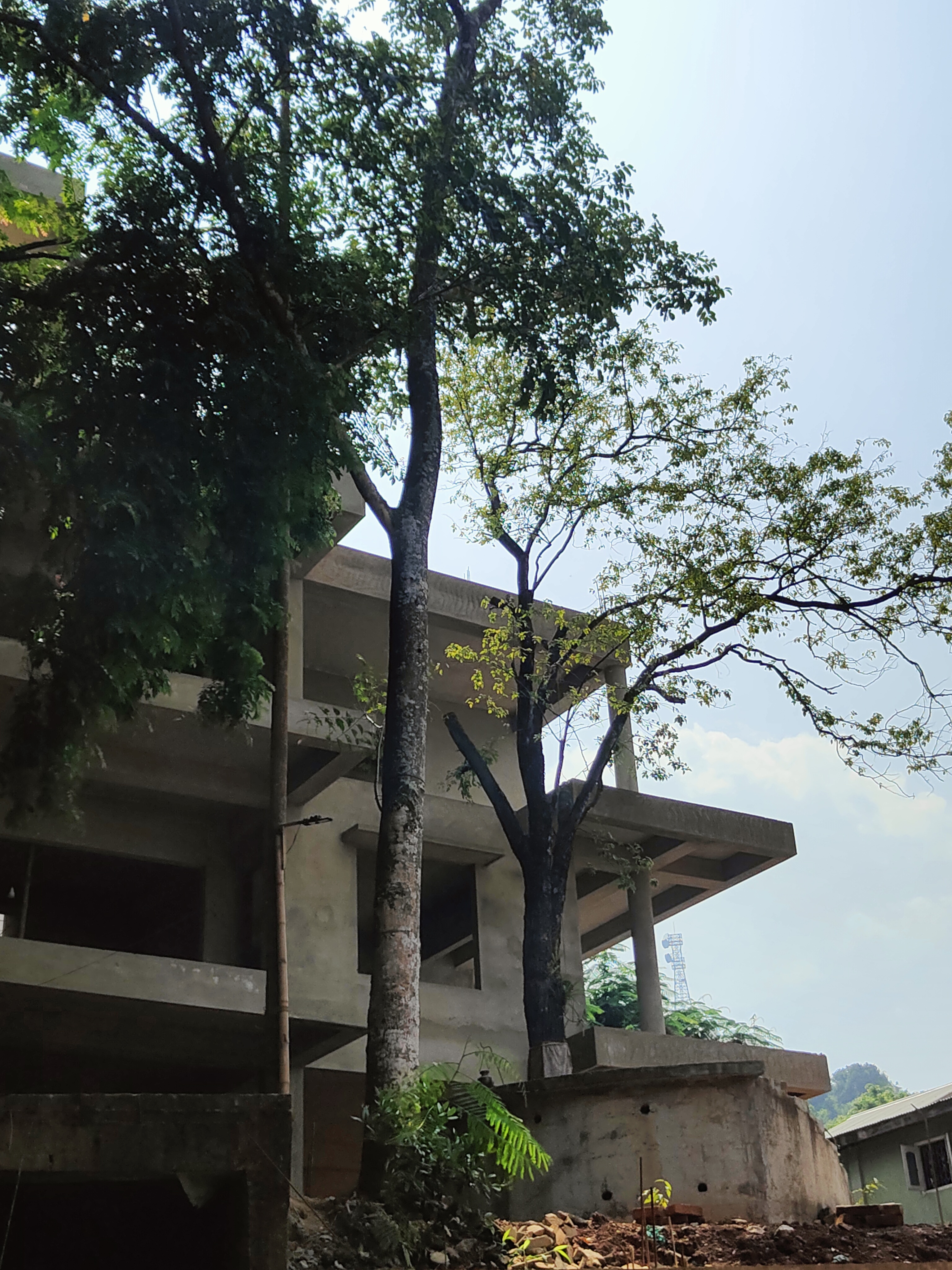 What is the condition of the house under construction in Kharguli belonging to Zubeen Garg