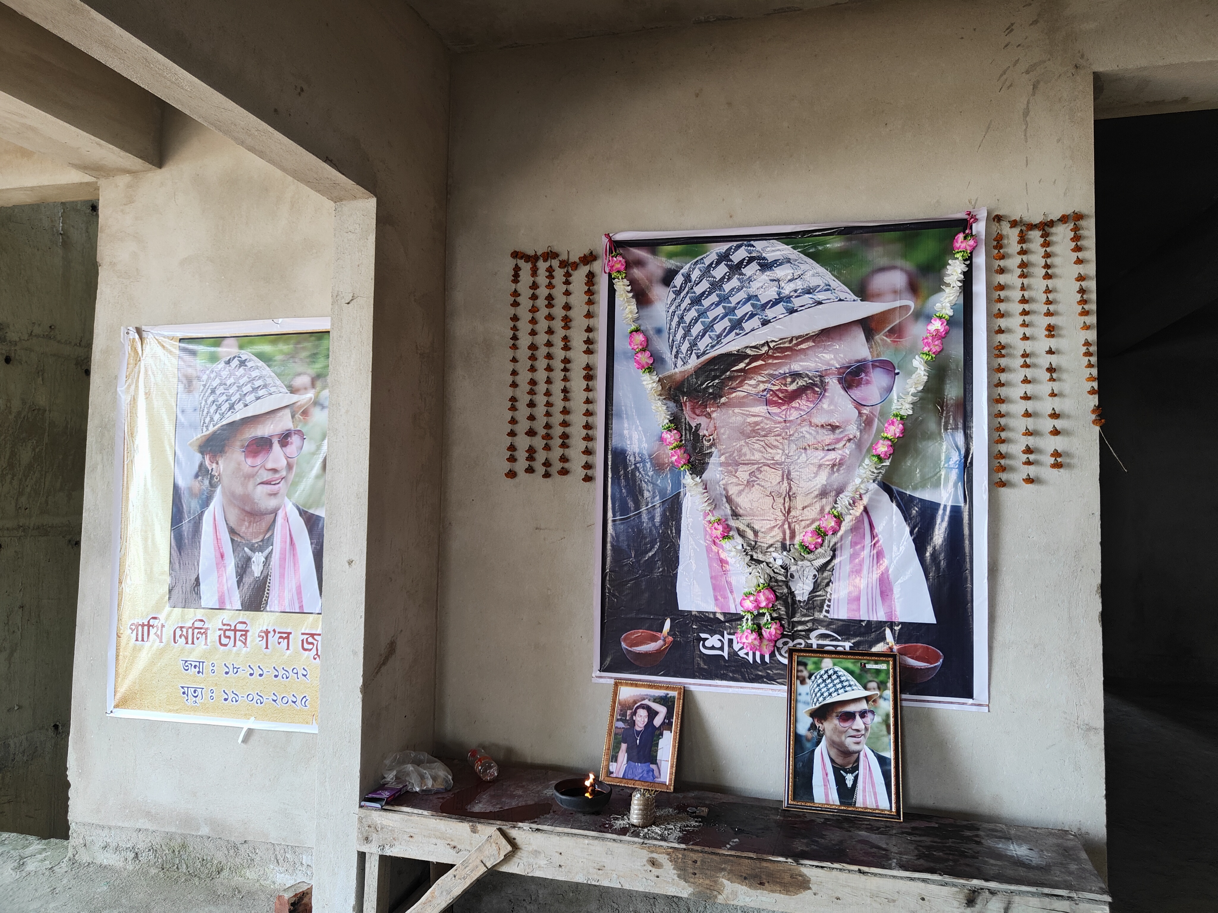 What is the condition of the house under construction in Kharguli belonging to Zubeen Garg