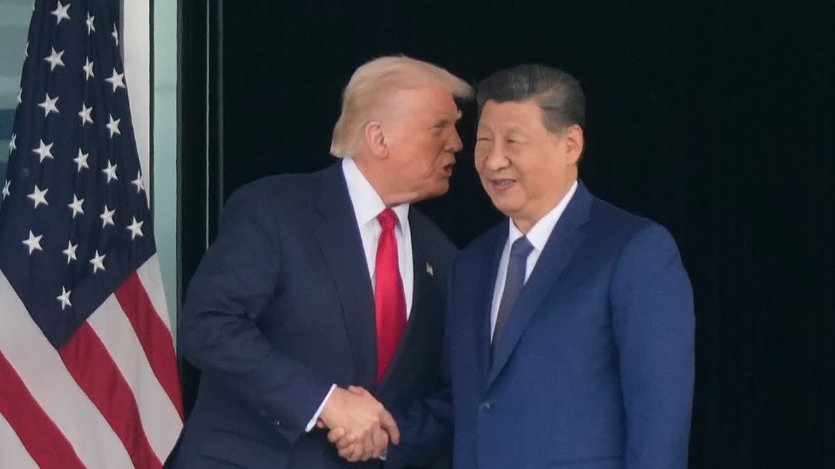 President Donald Trump, left, and Chinese President Xi Jinping, right, shake hands after their U.S.-China summit meeting at Gimhae International Airport Jinping in Busan, South Korea, Thursday, Oct. 30, 2025.