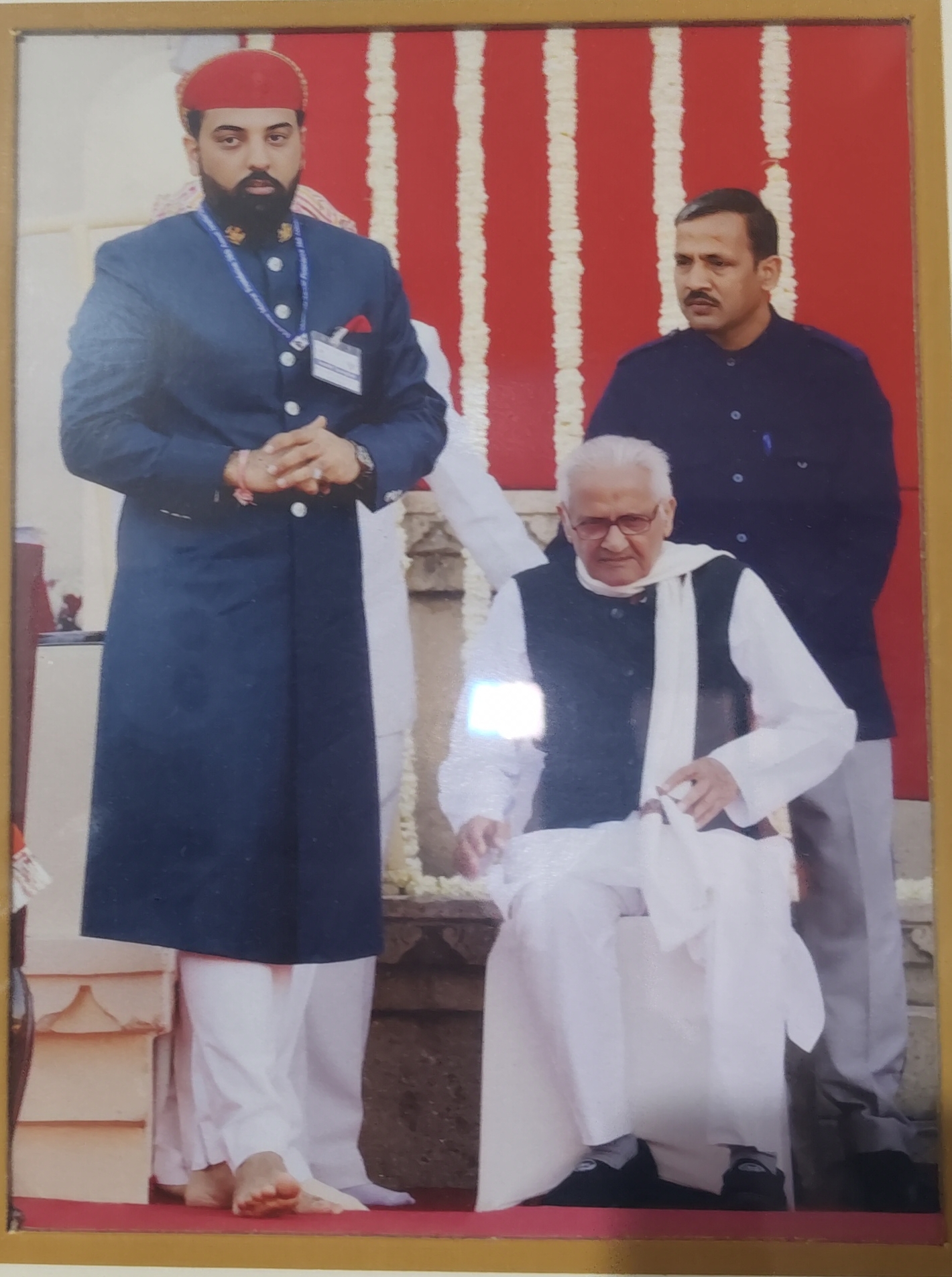 Poet Pandit Narendra Mishra (seated) at a literary event