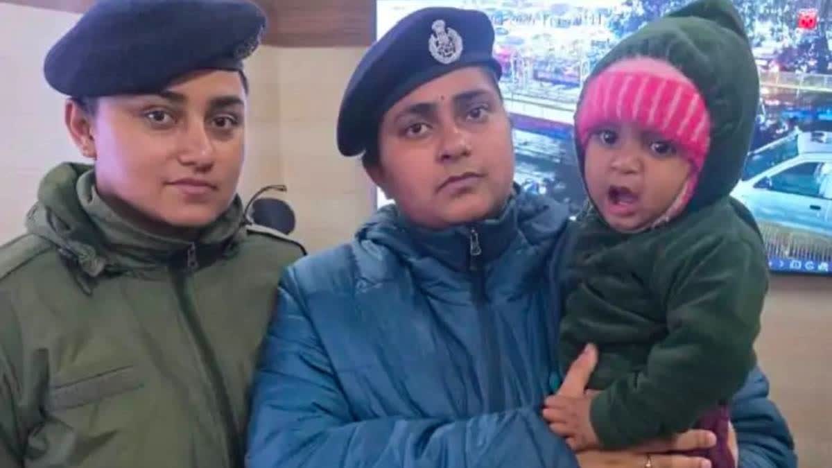 GRP and RPF personnel with the infant at Kanpur railway station.