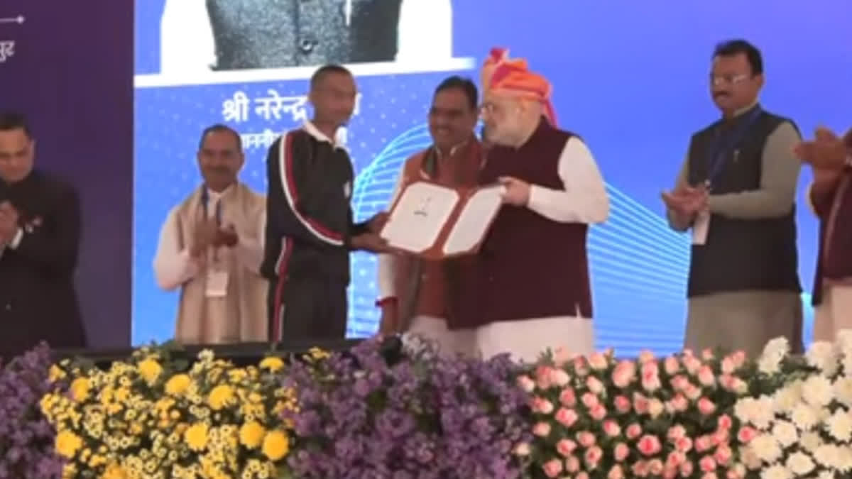 Amit Shah presenting appointment letter