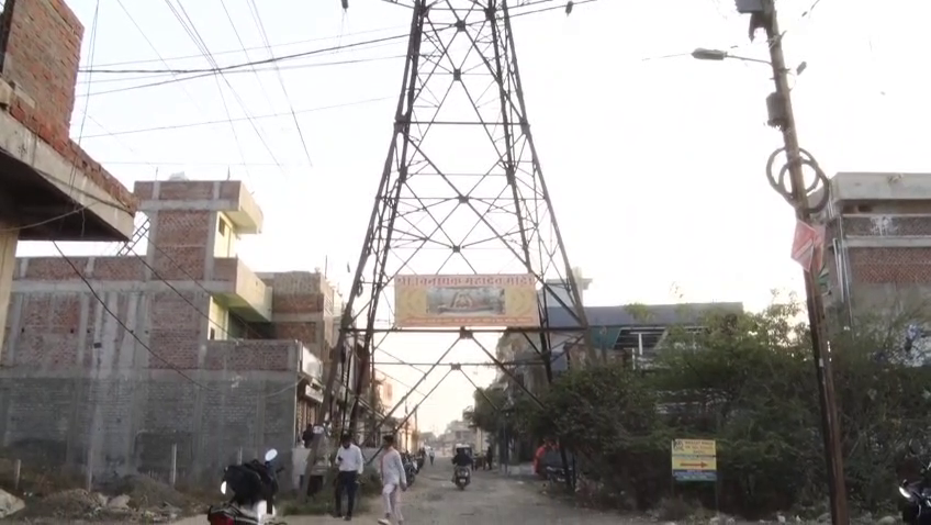 HIGH TENSION TOWER ON ROAD