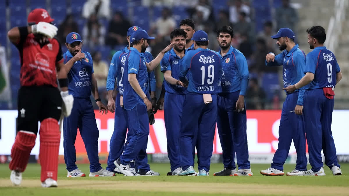 Asia Cup: Sediqullah, Omarzai, Bowlers Carry Afghanistan To 94-Run Win Over Hong Kong Hong Kong's Anshuman Rath walks off the field after losing his wicket as Afghanistan players celebrates the dismissal during the Asia Cup Cricket match between Afghanistan and Hong Kong at Zayed Cricket Stadium in Abu Dhabi, United Arab Emirates, Tuesday, Sept. 9, 2025.