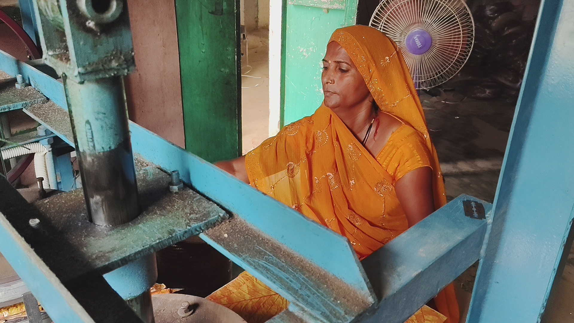 Seema opeates a an advanced machine.