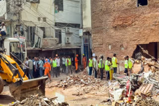 Visuals from the Satya Niketan building collapse site