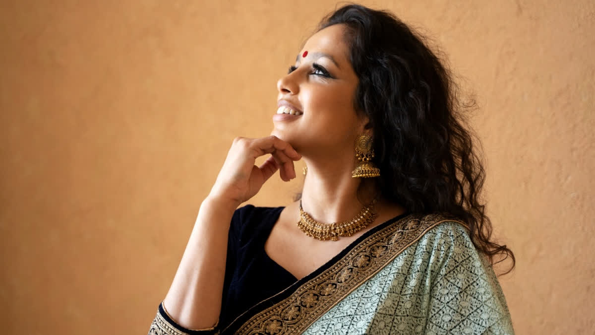 Woman wearing gold earrings