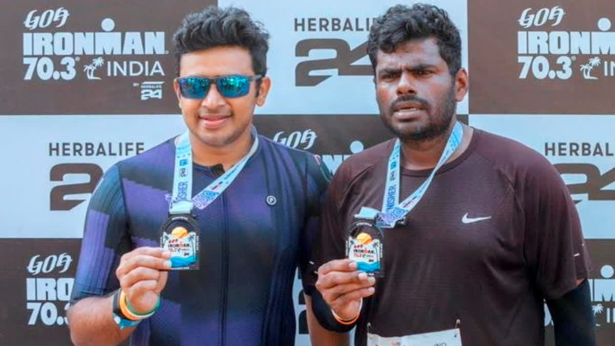 In this image posted on Nov. 9, 2025, BJP leaders K. Annamalai and Tejasvi Surya pose for a photograph after participating in the 'Ironman 70.3 Goa 2025' long-distance triathlon race.