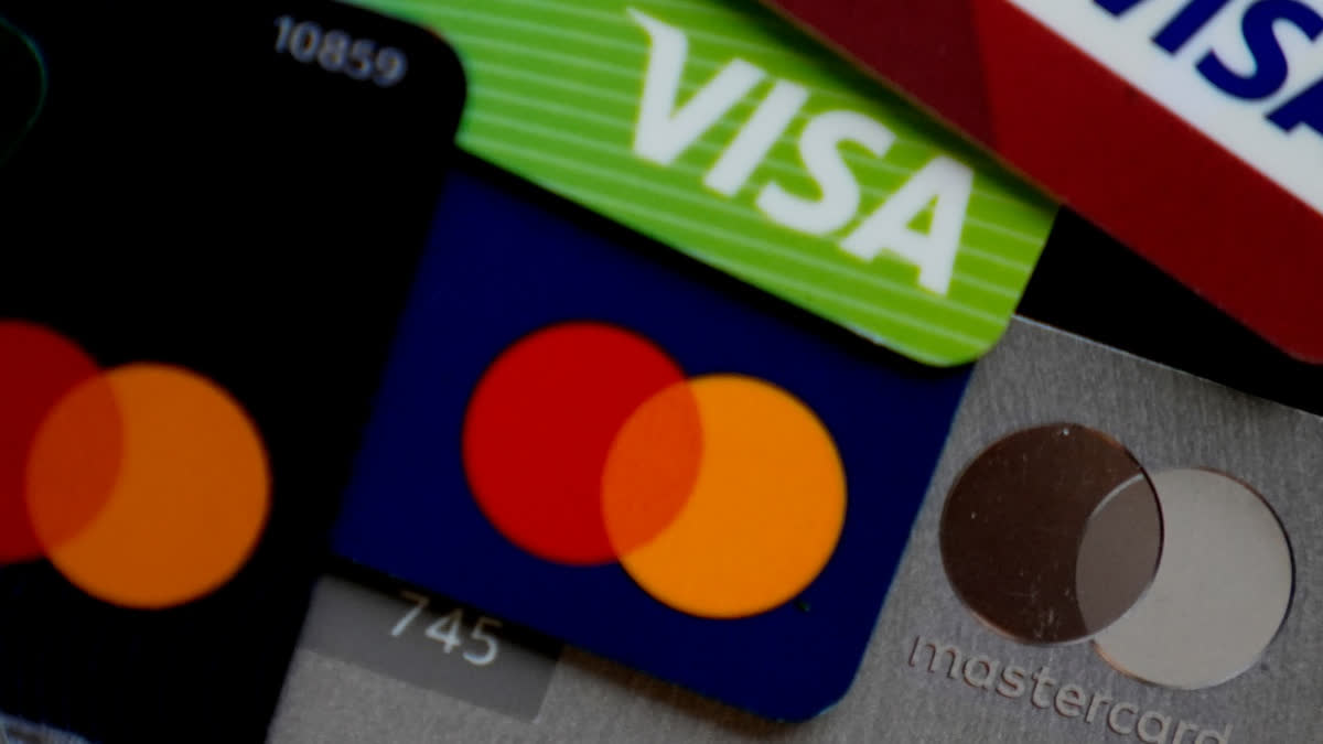 FILE - Visa and Mastercard credit cards are shown in Buffalo Grove, Ill., Feb. 8, 2024.