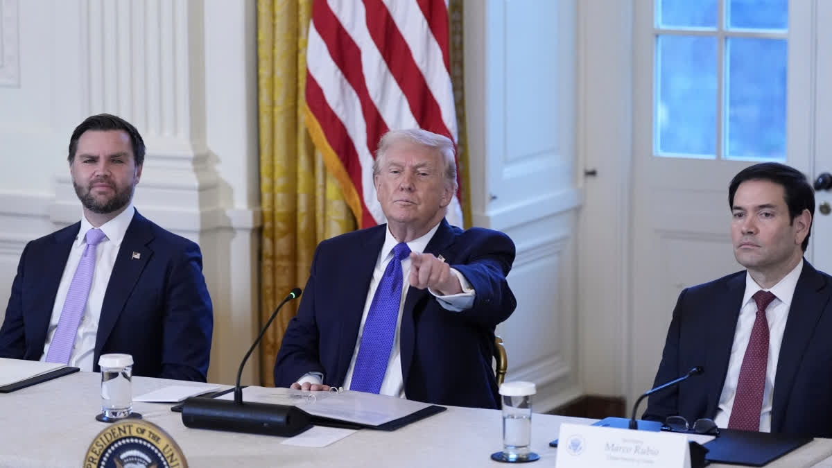 President Donald Trump chooses a reporter to ask a question with Vice President JD Vance, left, and Sec. of State Marco Rubio, right, during a meeting with oil executives in the East Room of the White House, Friday, Jan. 9, 2026, in Washington.