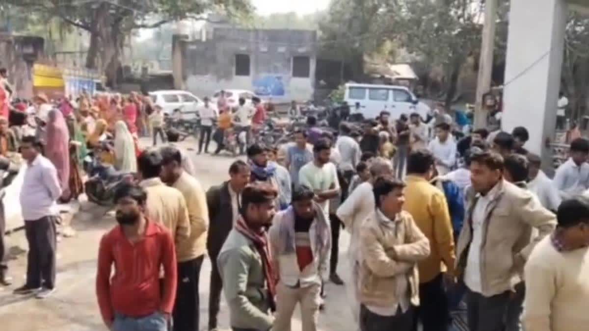 Family members of the woman at the hospital where she is undergoing treatment.