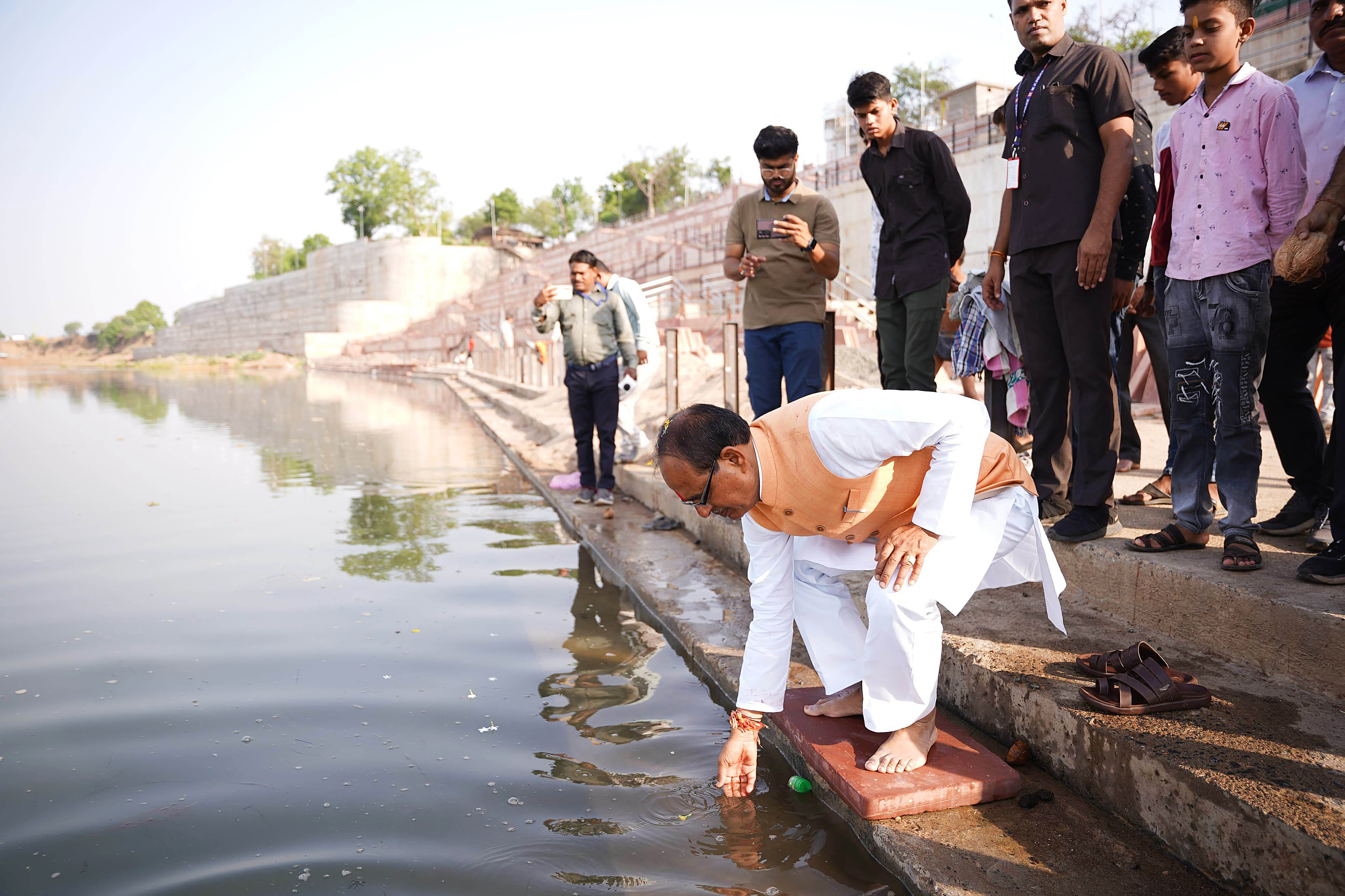 FILE - Former Madhya Pradesh Chief Minister Shivraj Singh Chouhan offering prayers at the banks of Narmada River in Sehore.