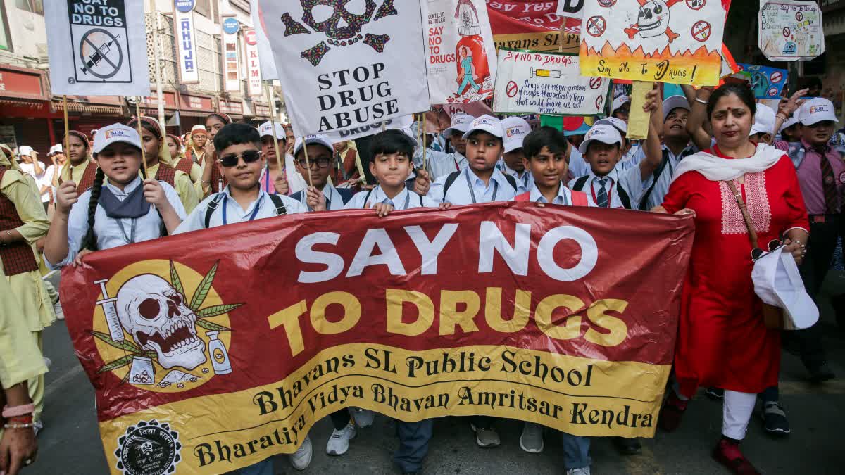 Students hold banners and placards with anti-drugs slogans on them during the six-day ‘padyatra’ (foot march) to create awareness against drug issue led by Punjab Governor Gulab Chand Kataria, in Amritsar.