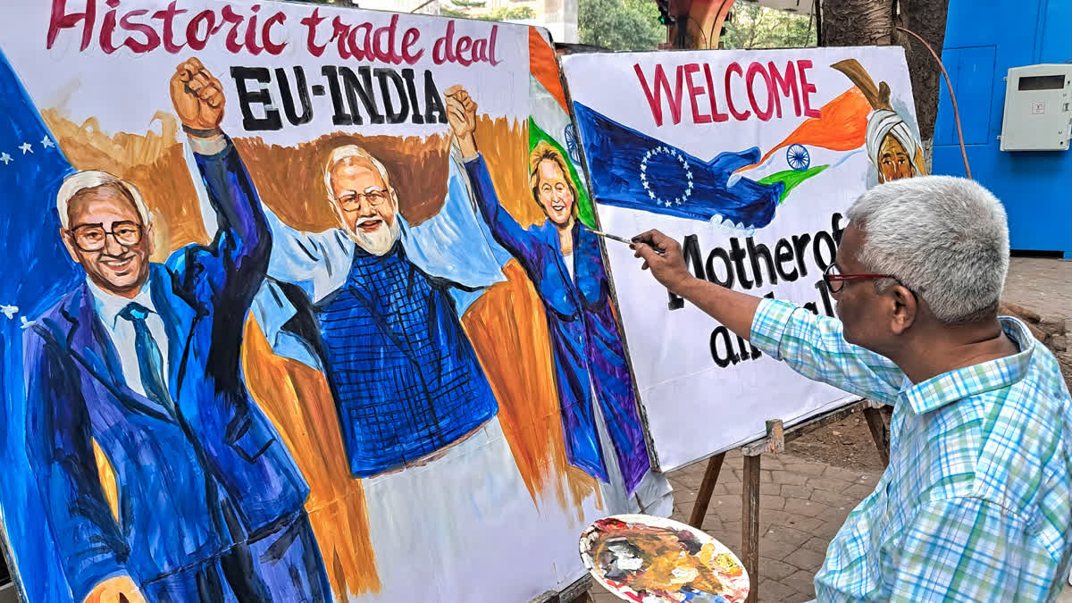 FILE - A teacher from Gurukul School of Art creating an artwork welcoming the the proposed India-EU Free Trade Agreement, in Mumbai.