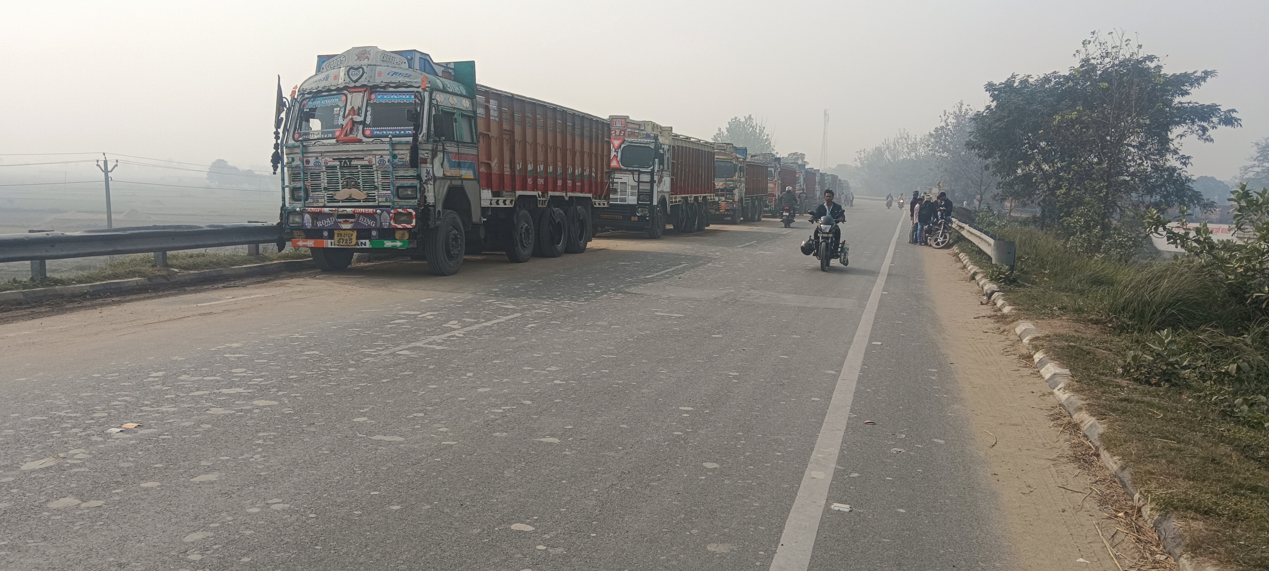 Trucks parked on a roadside in Bihar