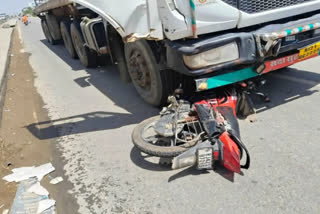 Bike crushed under a trailer