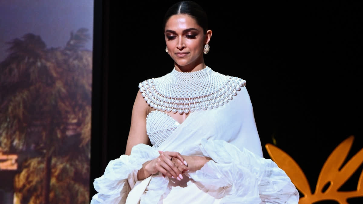 Deepika Padukone at the Cannes red carpet in 2022 wearing a white ruffled saree by Abu Jani Sandeep Khosla