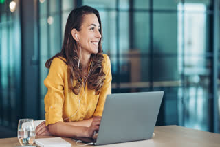 Mindfulness Day 2025: Practical And Easy Techniques To Sharpen Focus And Reduce Anxiety In Office Happy woman in office