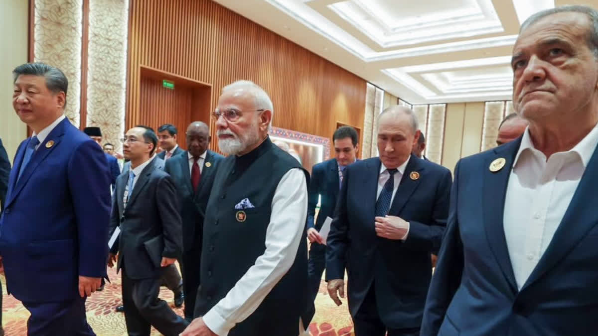 (From left) Xi, Modi, Putin and Pezeshkian at the 18th BRICS Summit