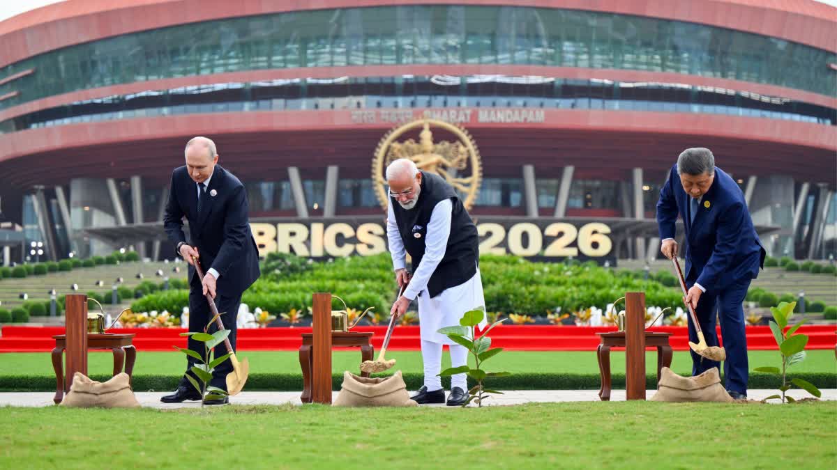 Prime Minister Narendra Modi, along with Chinese President Xi Jinping and Russian President Vladimir Putin, participates in a joint tree plantation initiative during the BRICS Summit at Bharat Mandapam, in New Delhi on Saturday.