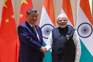 PM Modi shaking hands with Chinese President at the BRICS summit.