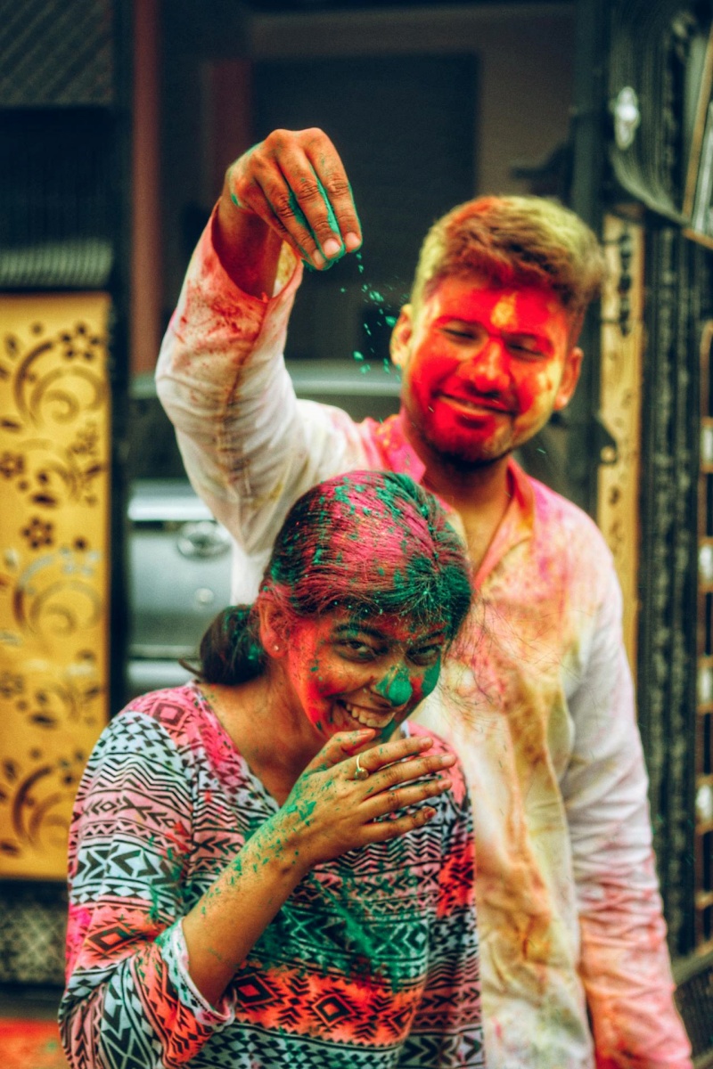 Man and woman playing Holi