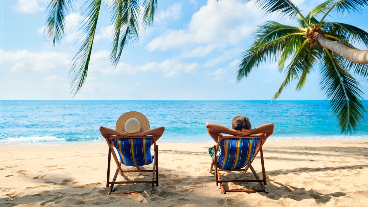 Couple relaxing on a beach holiday