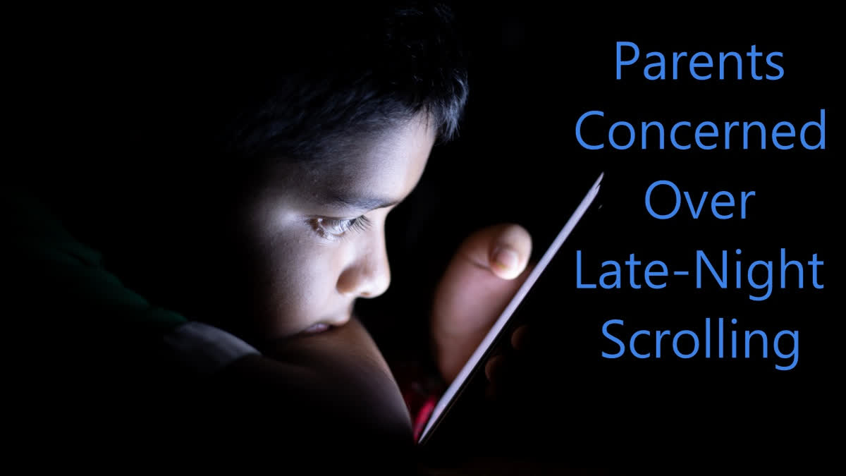 Teenager scrolling at night