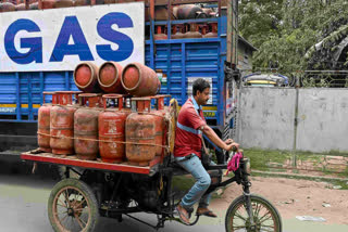 A vendor en route to deliver liquefied petroleum gas (LPG) cylinders in Nadia, West Bengal.