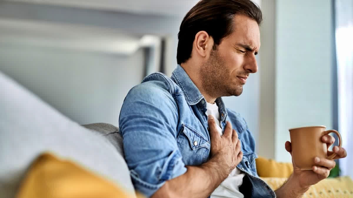 Young man having chest pain