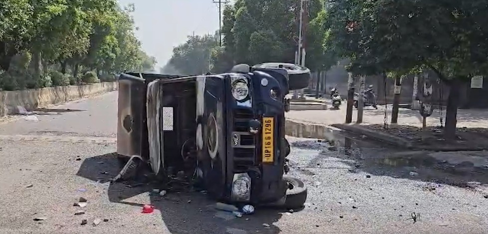 Protesters torch vehicles in Noida.